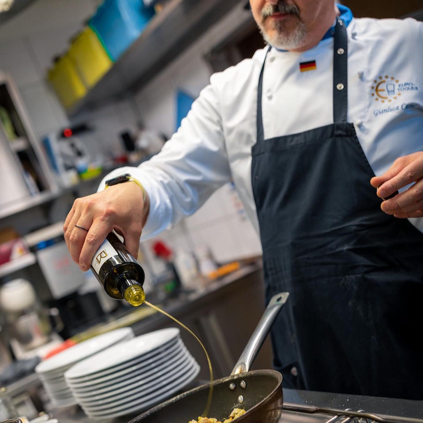 A chef cooking with Olio Divino olive oil.